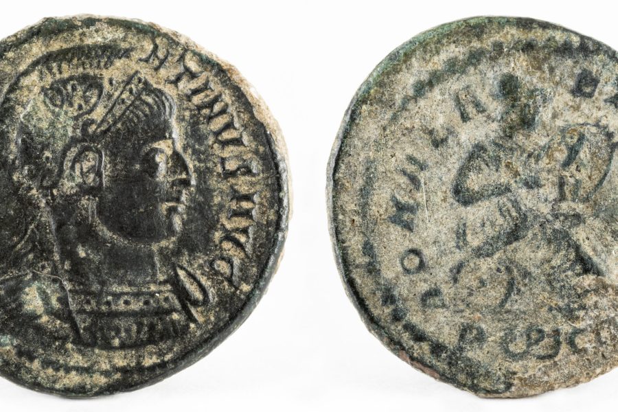 A macro shot of an ancient Roman copper coin of Emperor Constantine I Magnus.